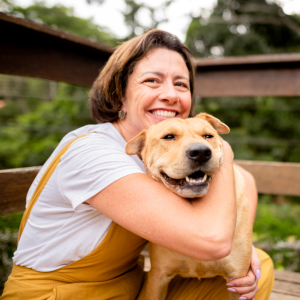 happy woman hugging her dog